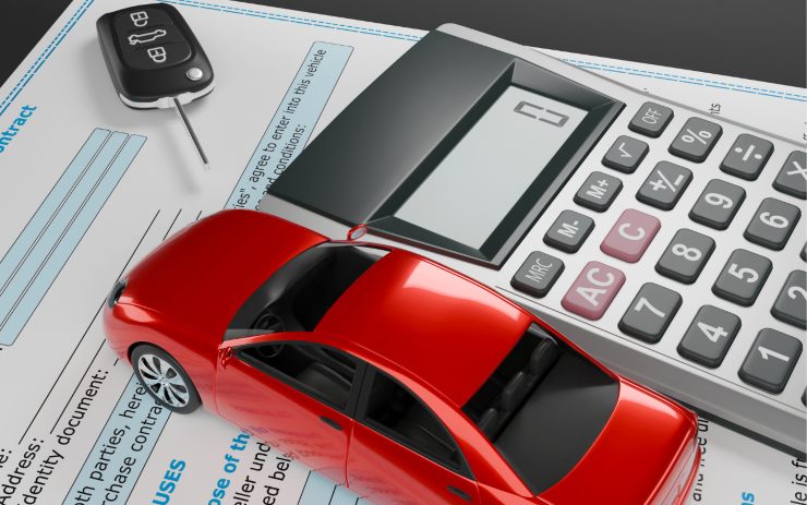Calcolatrice e auto in miniatura