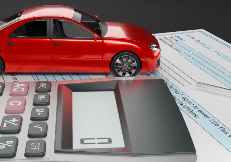 Auto in miniatura e calcolatrice che segna la cifra "0"