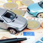 Modellini auto e soldi