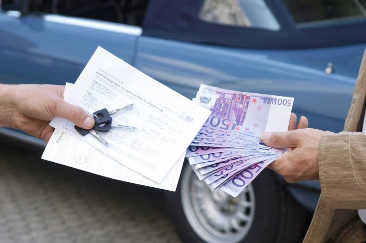Documenti passaggio di proprietà auto e scambio denaro